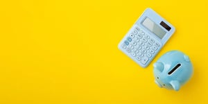 Calculator and piggy bank to calculate savings 