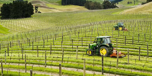 booster-blog-private-land-and-property-fund-investing-tractors-in-vineyard-new-zealand
