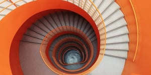 booster-blog-tiered-fee-rebates-spiral-staircase-new-zealand